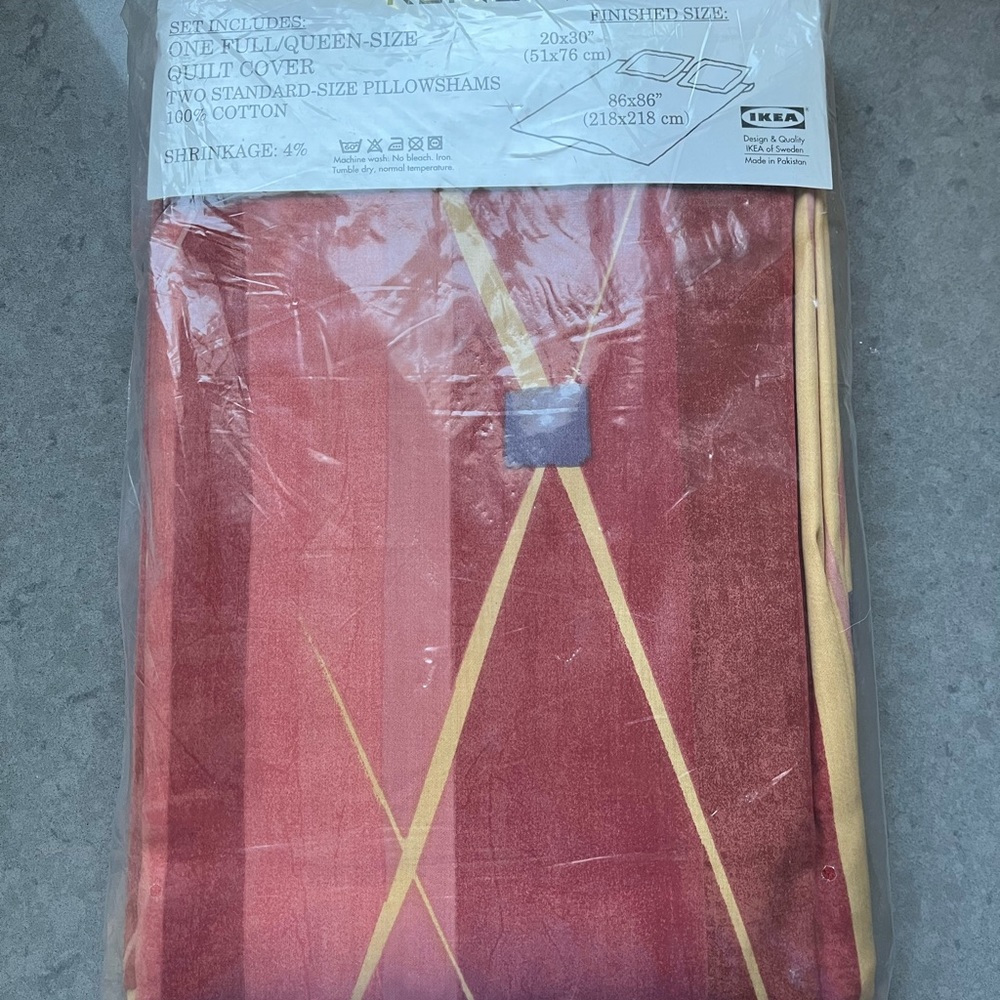 IKEA duvet cover with 2 pillow cases. New in red, yellow and rust